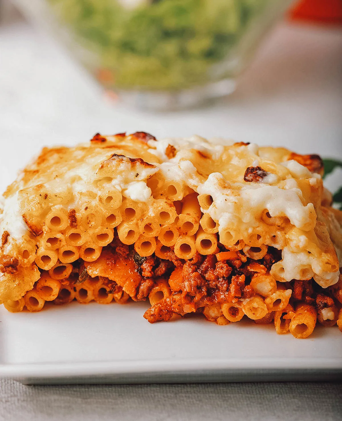 Egyptian Food Macaroni bechamel with tomato sauce, one of the most popular and comforting Egyptian dishes