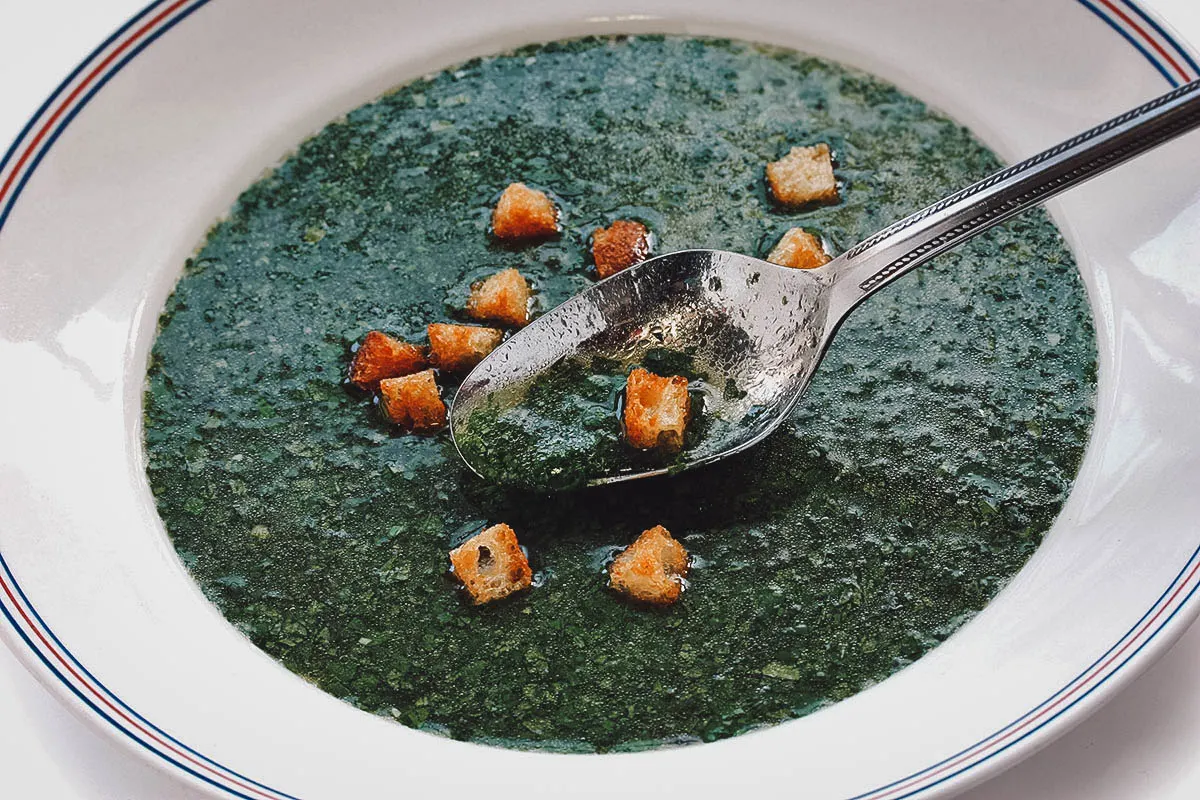Egyptian Food Close-up of mulukhiya, an Egyptian soup made with jute leaves in chicken broth