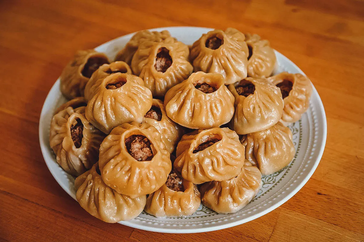 Plate full of buuz, Mongolian dumplings traditionally made to celebrate Tsagaan Sar