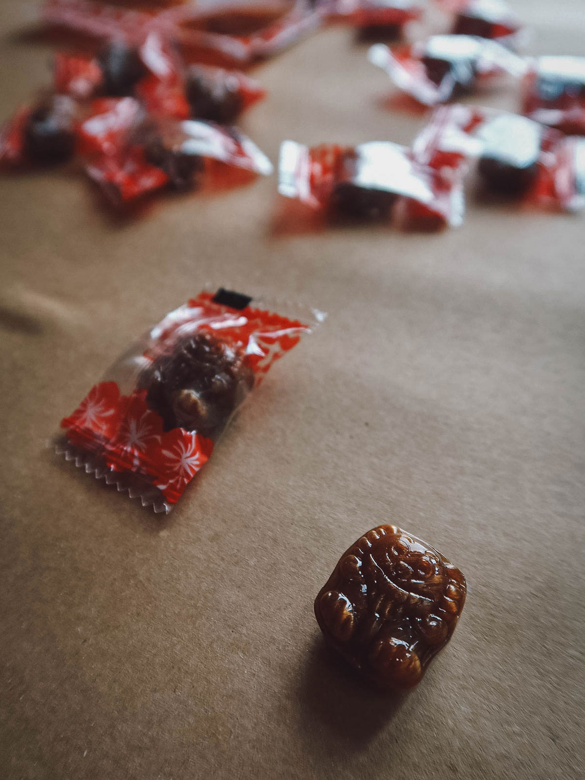 Brown sugar shisa candies from Sakuraco on a table