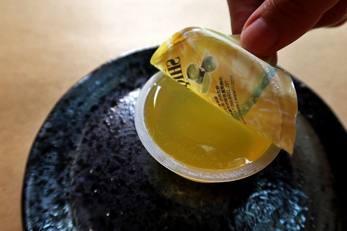 Peeling open the shikuwasa jelly from Sakuraco