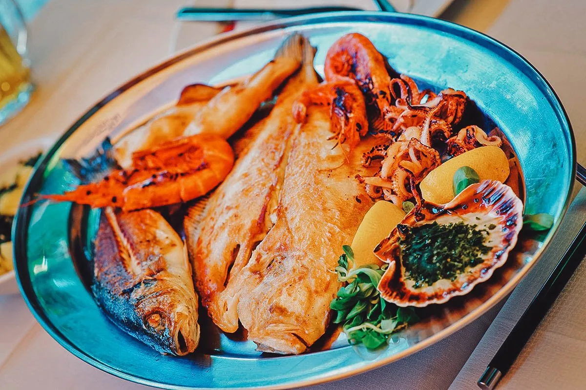 Seafood platter with grilled fish, squid, shrimp, and scallops