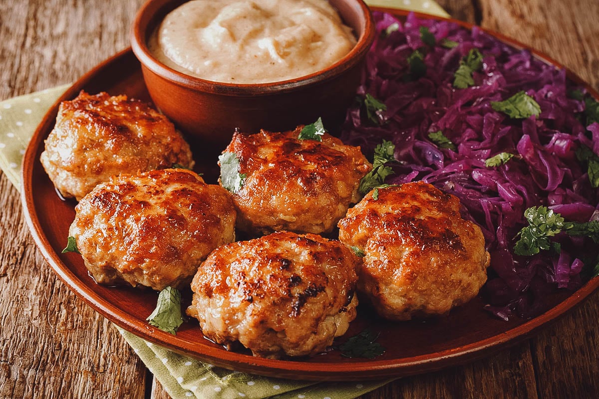 Frikadeller or Danish meat patties with pickled vegetables