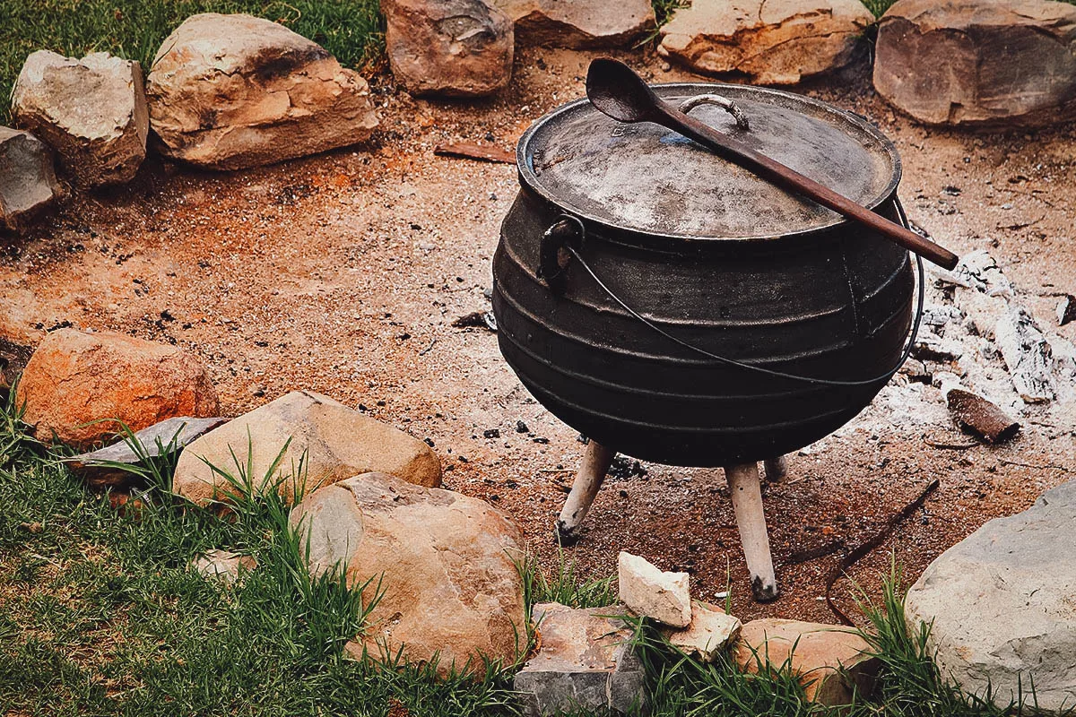 South African Food Potjie, a cast iron pot used to cook potjiekos over hot coals