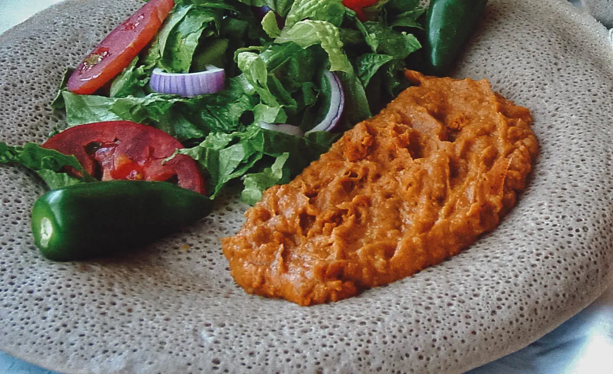 Ethiopian Food Shiro wat with salad and injera