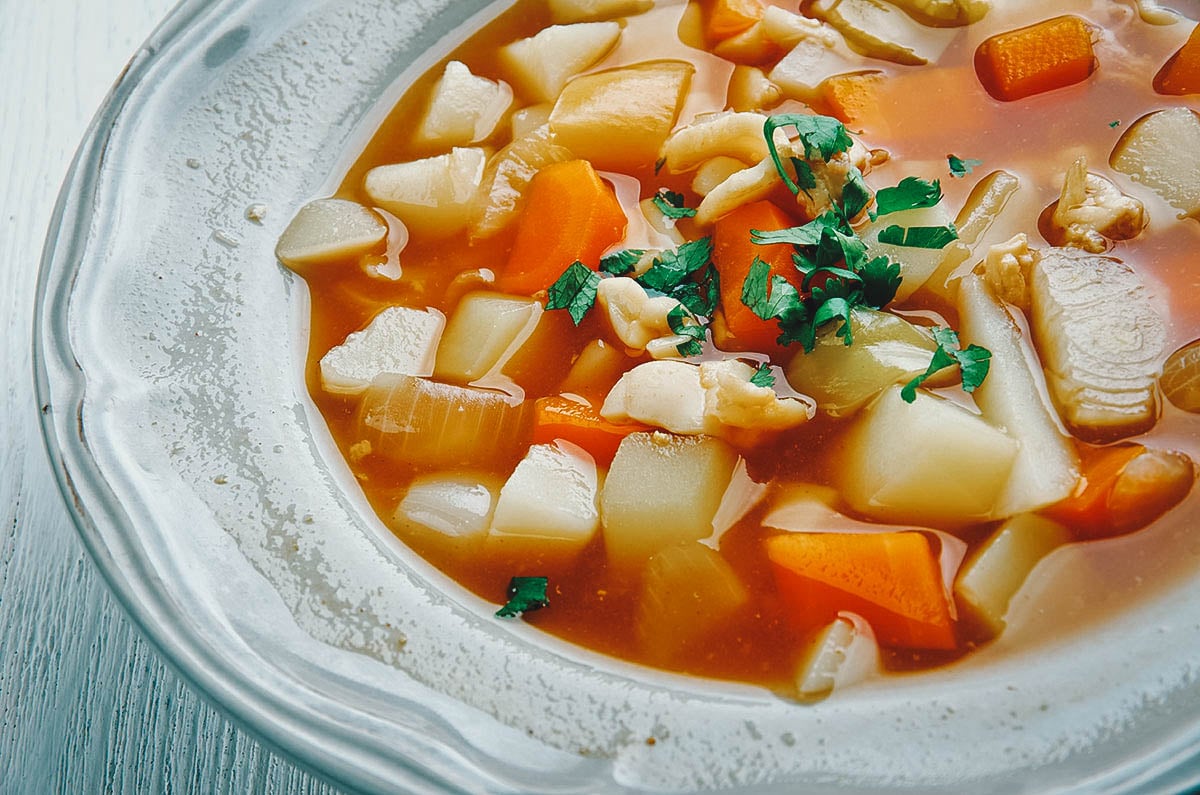 Conch chowder, a popular soup or stew in Bahamian cuisine made with conch meat, tomato paste, and vegetables