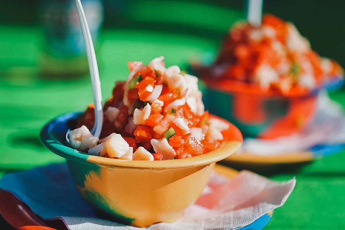 Bahamian Food Conch salad, a popular dish made with diced conch meat, chopped green pepper, fresh lime juice, and orange juice