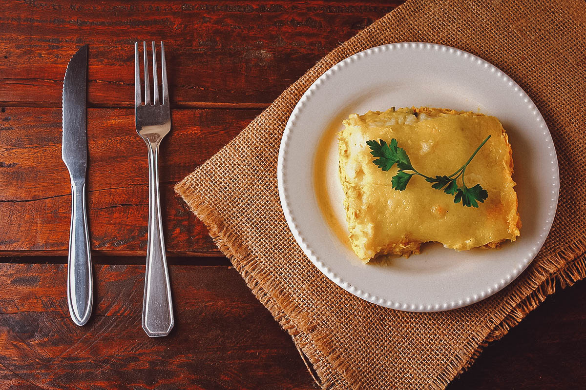 Escondidinho, a Brazilian casserole made with meat, tomato sauce, and mashed tubers