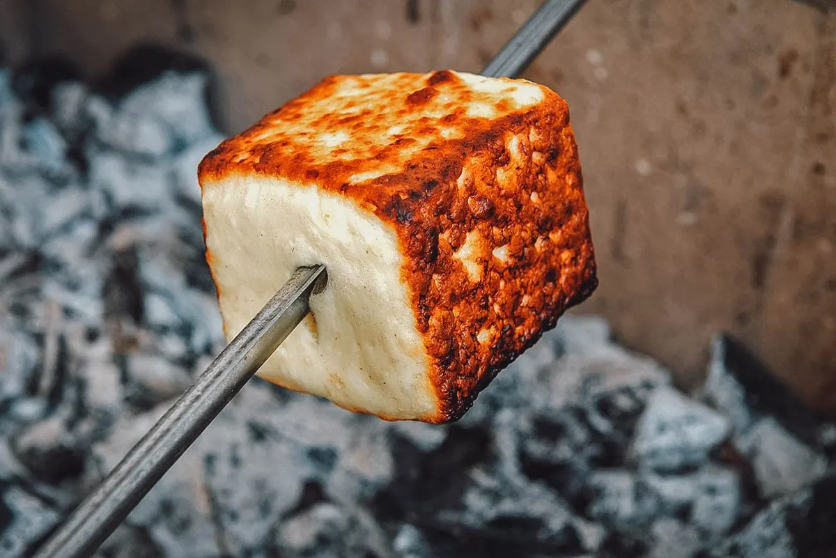 Queijo coalho, a type of skewered and grilled Brazilian cheese sold as street food