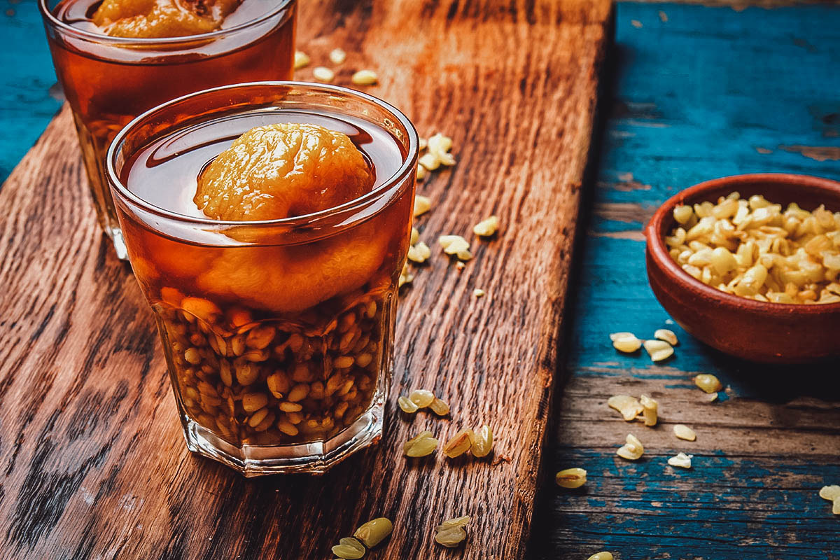 Mote con huesillo, a Chilean drink made with hulled wheat and cooked dried peaches