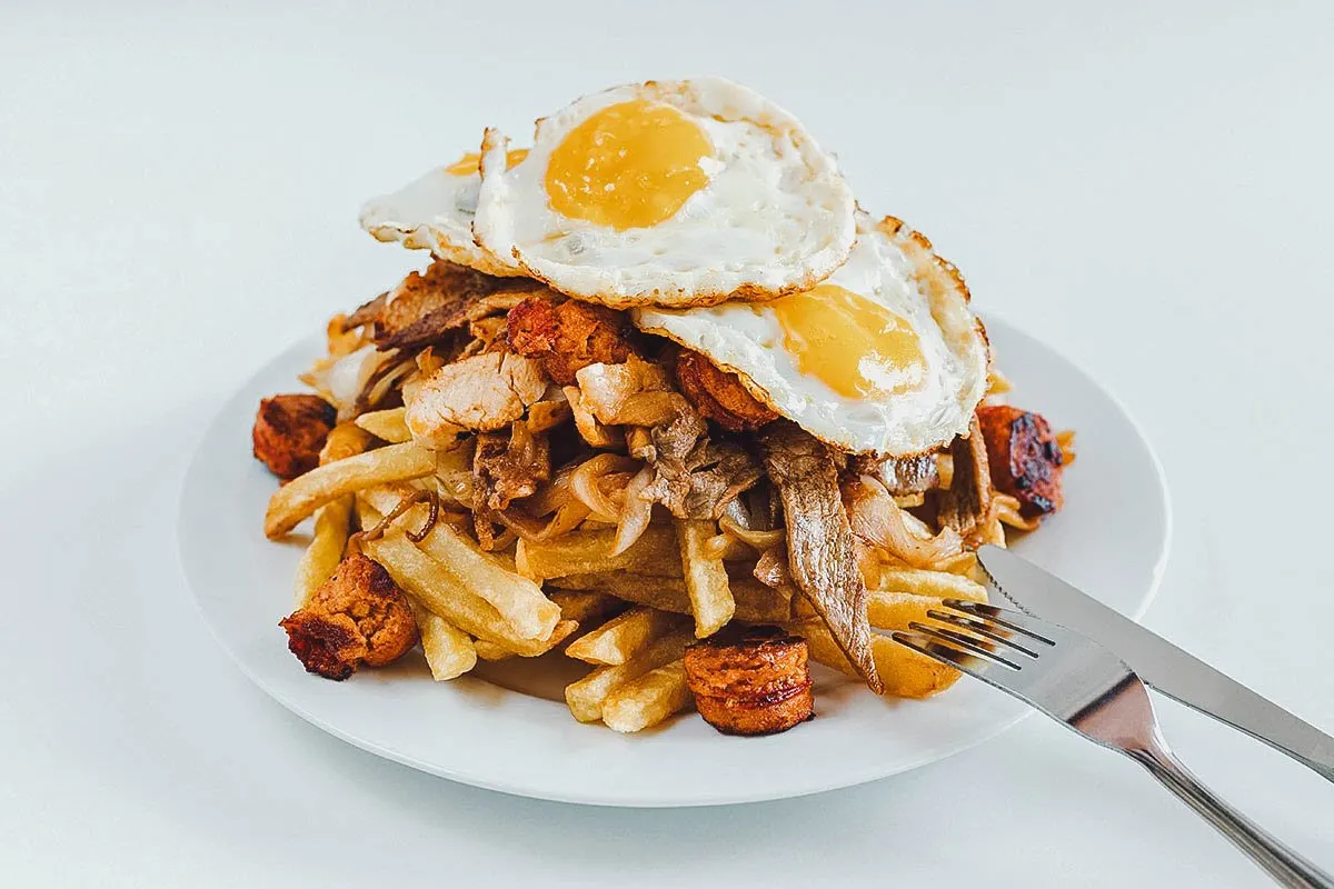 Chilean Food Chorrillana topped with fried egg