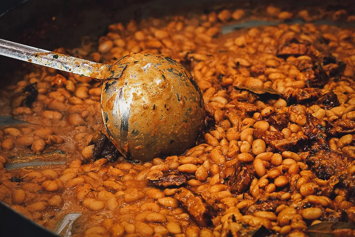 Romanian Food Fasole cu ciolan, a traditional Romanian dish of smoked pork meat and beans