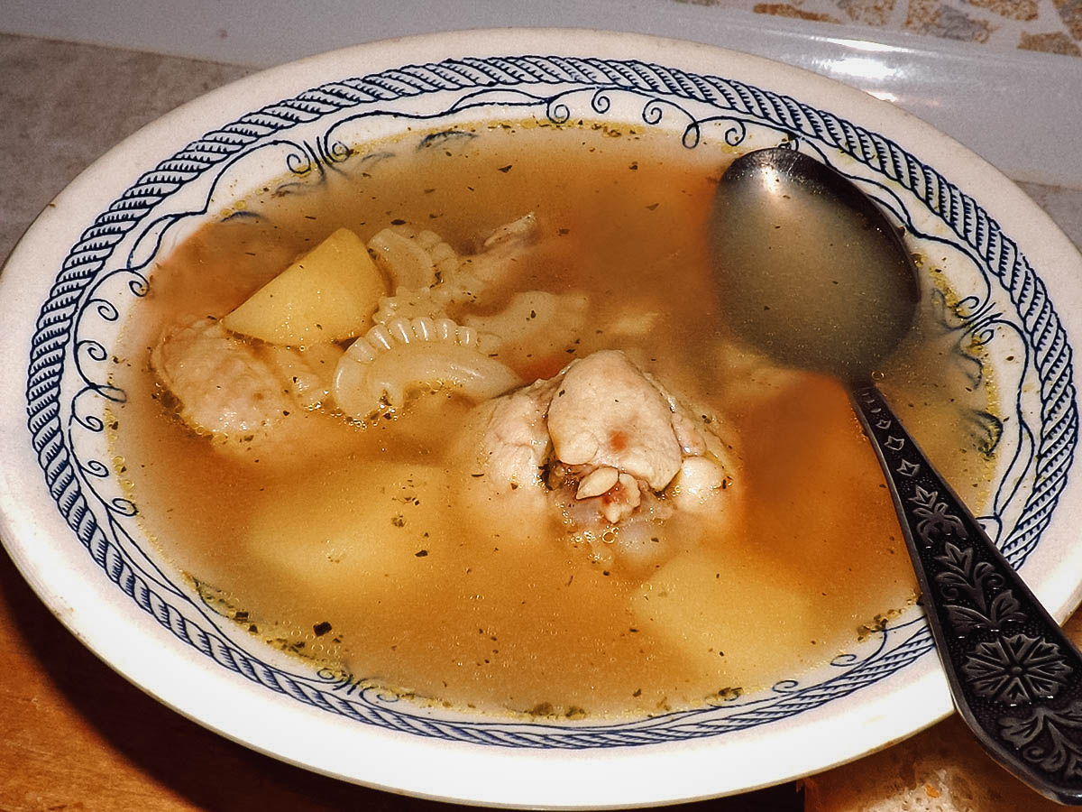 Chicken souse, a popular Bahamian breakfast dish made with boiled chicken