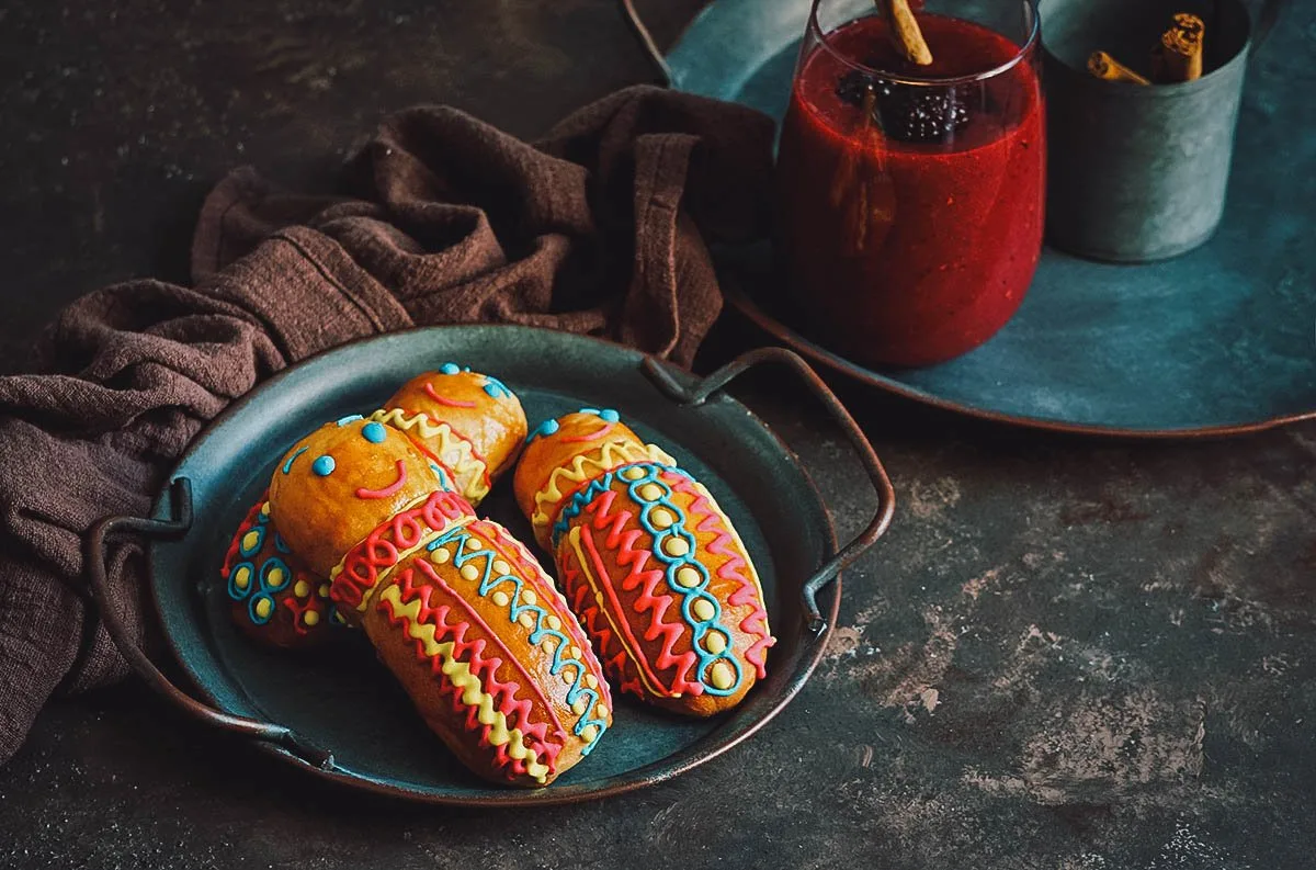 Guaguas de pan and colada morada, traditional Ecuadorian foods made for El Dia de los Difuntos