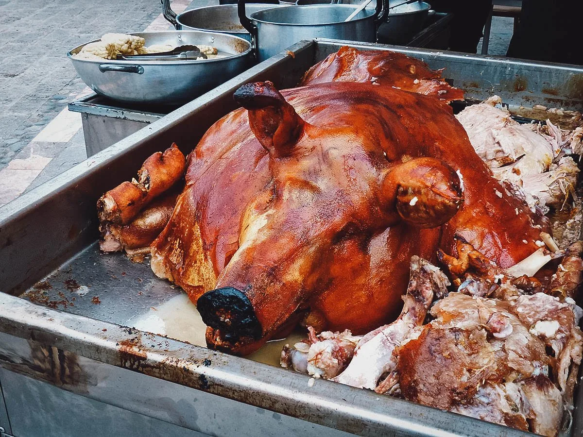 Hornado or Ecuadorian roast pig at a market in Quito