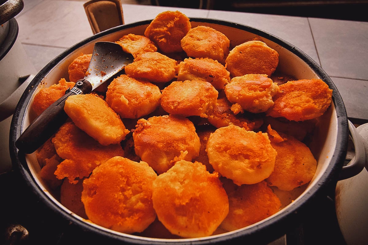 Pot of llapingachos or Ecuadorian-style fried potato cakes