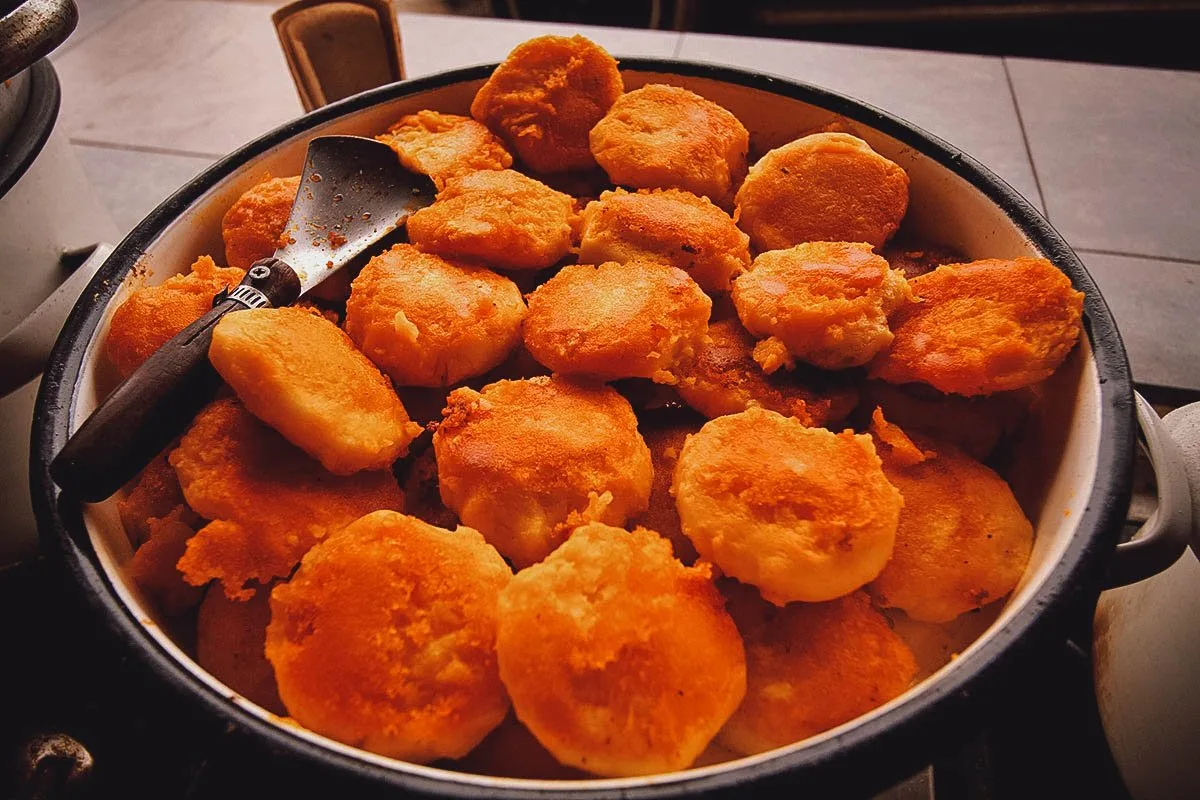 Ecuadorian Food Pot of llapingachos or Ecuadorian-style fried potato cakes