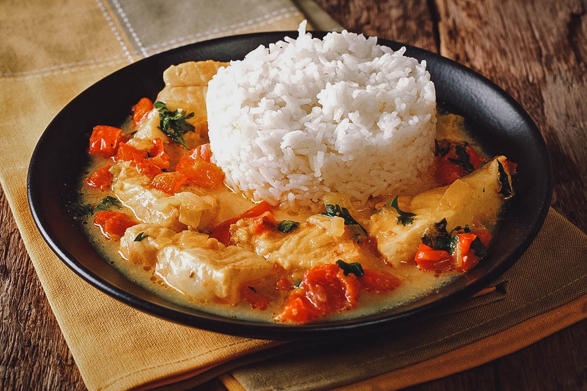 Plate of pescado encocado, an Ecuadorian fish dish made with coconut sauce