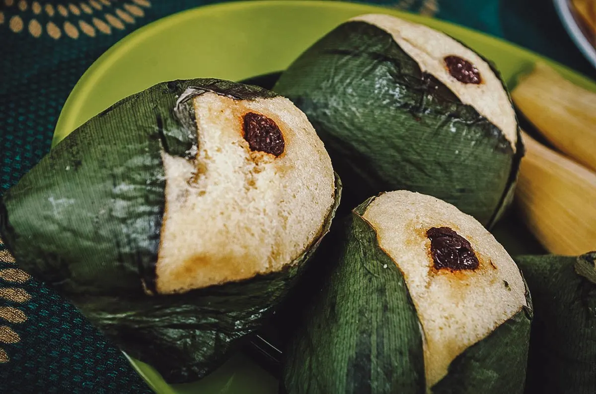 Ecuadorian quimbolitos on a plate decorated with raisins