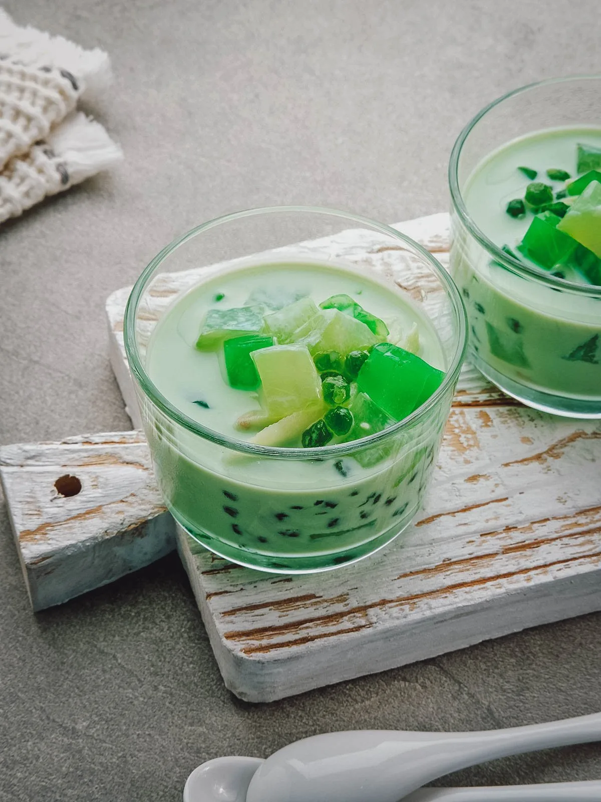 Glasses of buko pandan, a refreshing dessert made with shredded coconut, pandan, and sweetened condensed milk