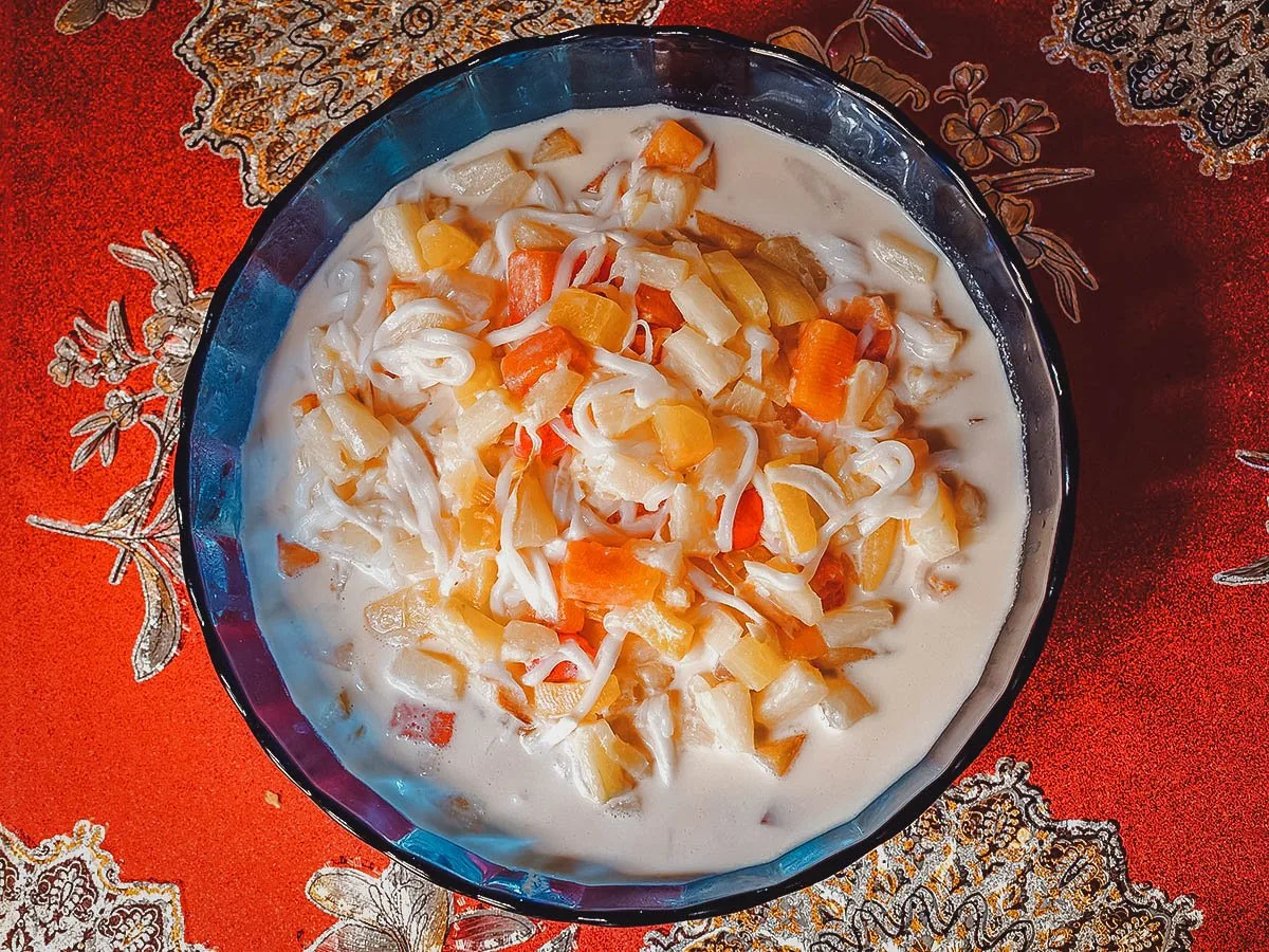 Bowl of Filipino-style fruit salad, a refreshing dessert made with fruit cocktail and condensed milk