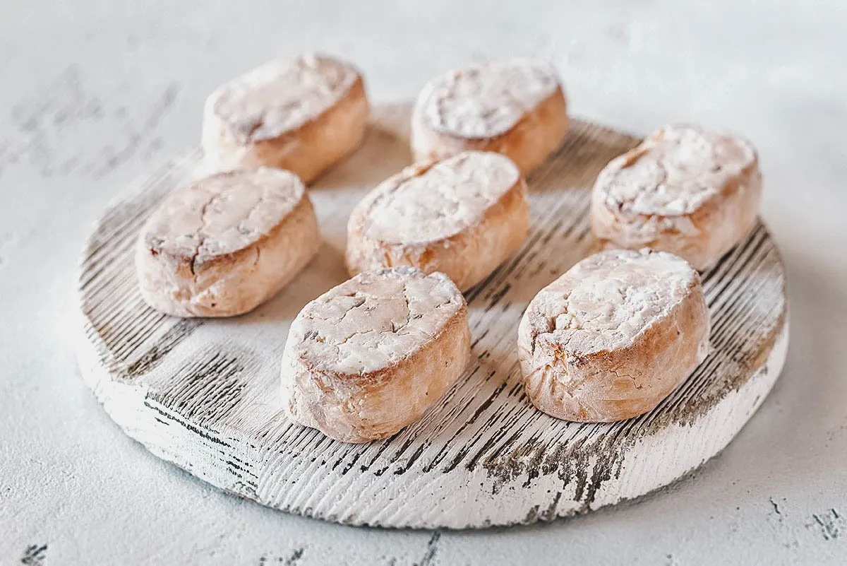 Filipino Desserts Batch of polvoron, a Filipino snack or candy made with powdered milk