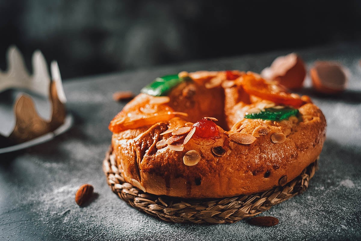 Bolo rei or Portuguese king cake topped with nuts and crystallized fruit
