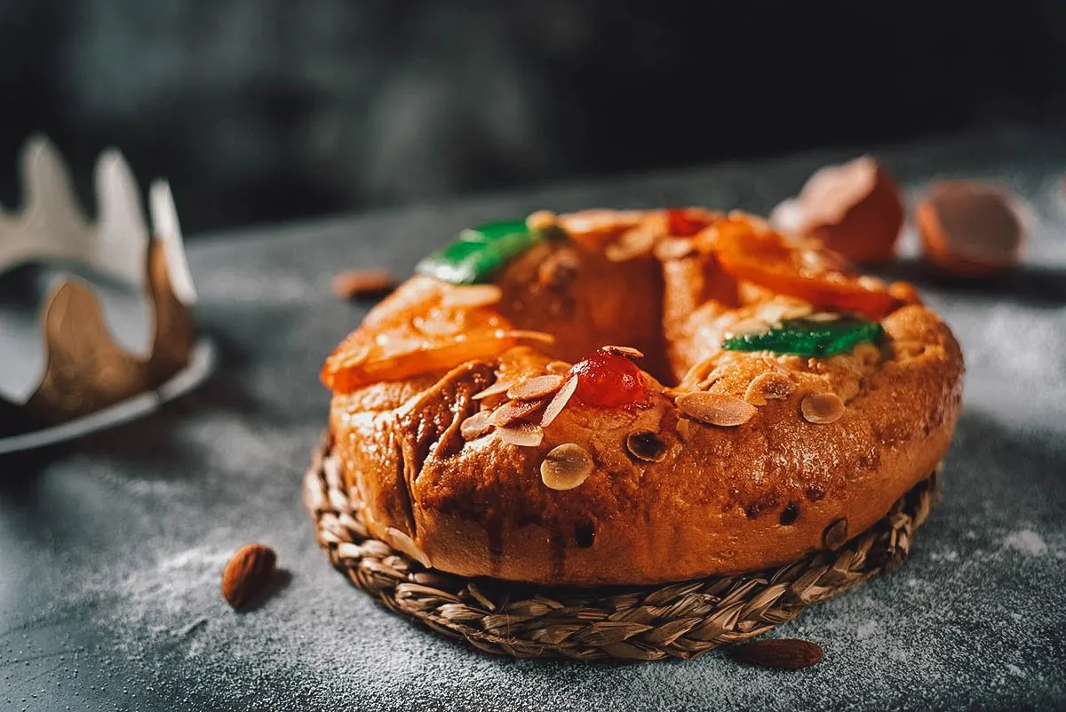 Bolo rei or Portuguese king cake topped with nuts and crystallized fruit