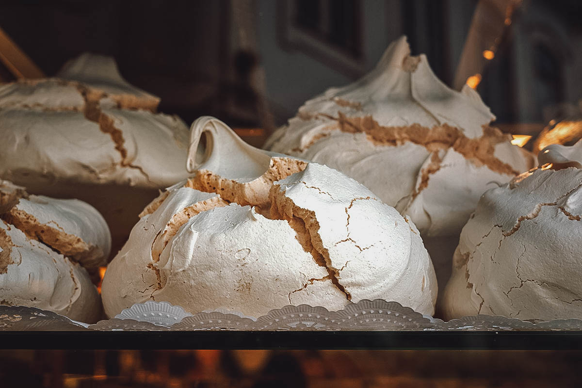 Batch of suspiros or Portuguese meringue cookies at a pastry shop