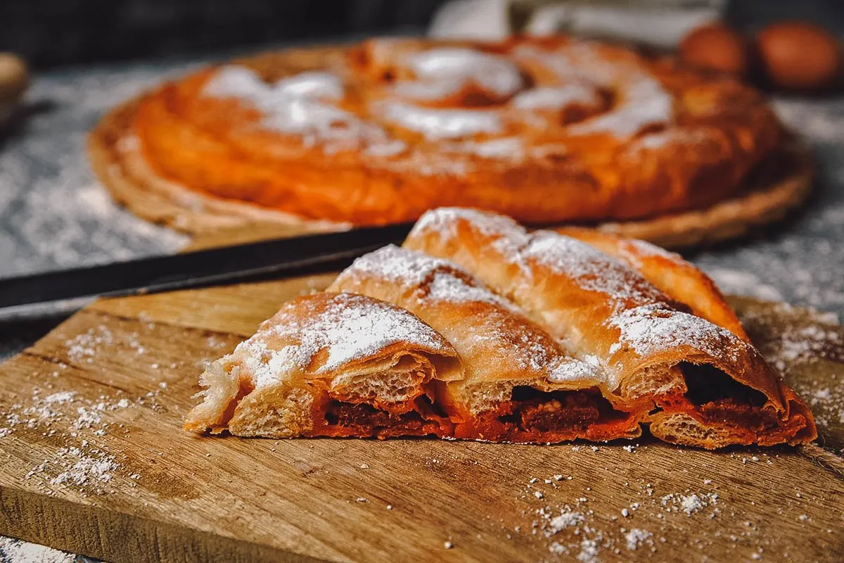 Spanish Desserts Ensaimada Spanish pastries generously dusted with powdered sugar