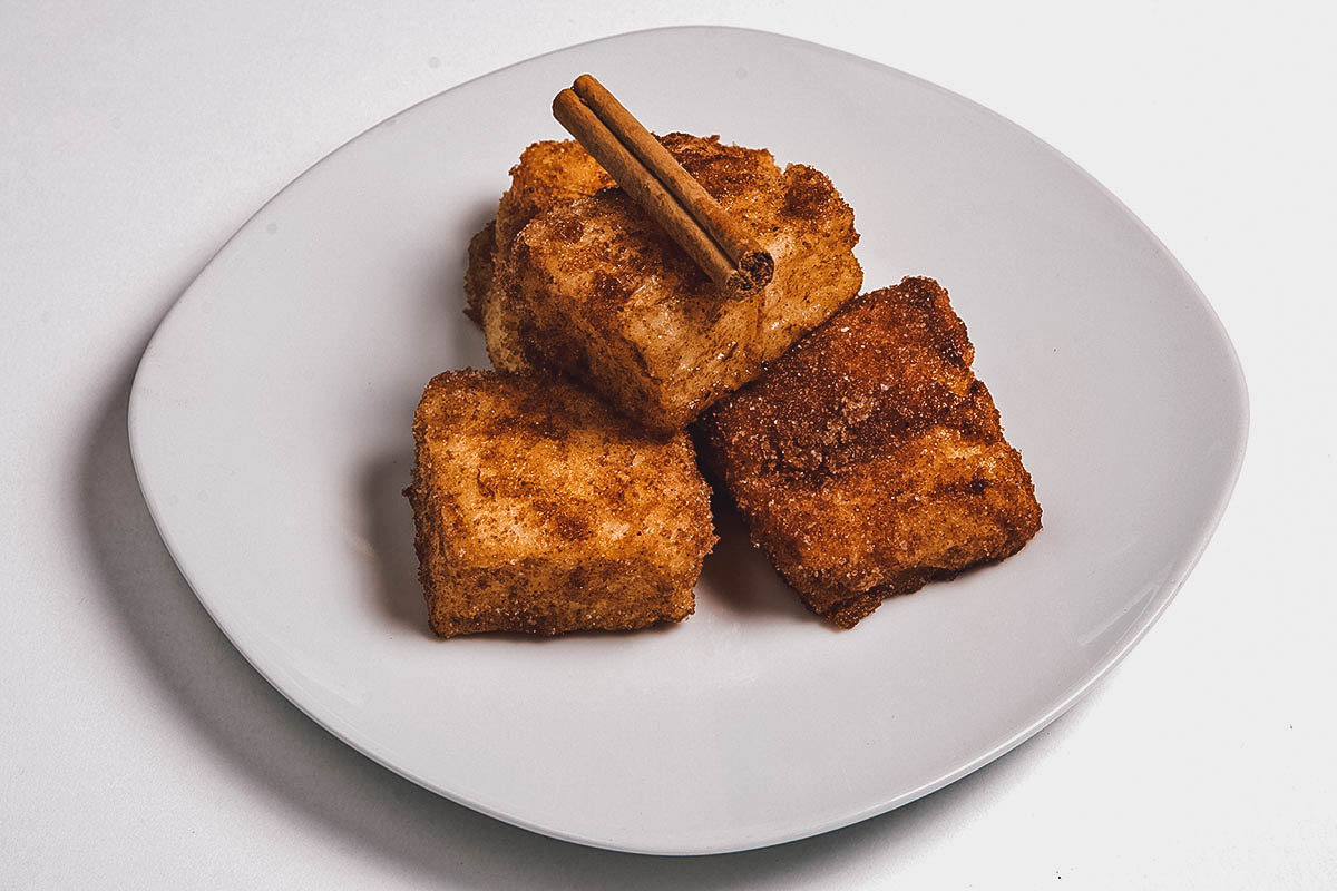 Plate of leche frita, deep-fried milk cooked in olive oil