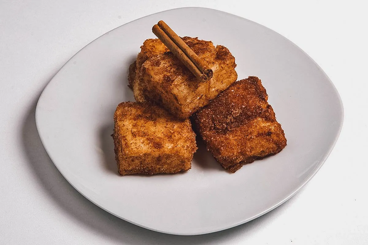 Spanish Desserts Plate of leche frita, deep-fried milk cooked in olive oil