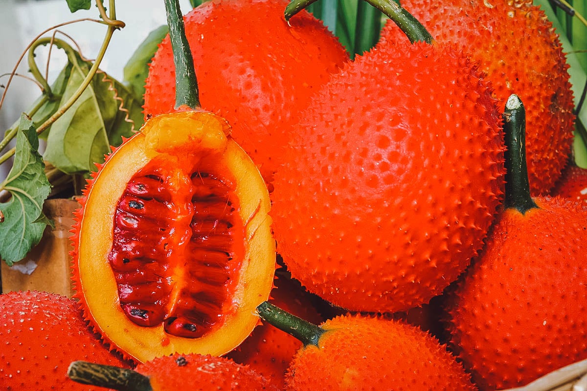 Gac, an exotic Thai fruit with bright reddish-orange skin