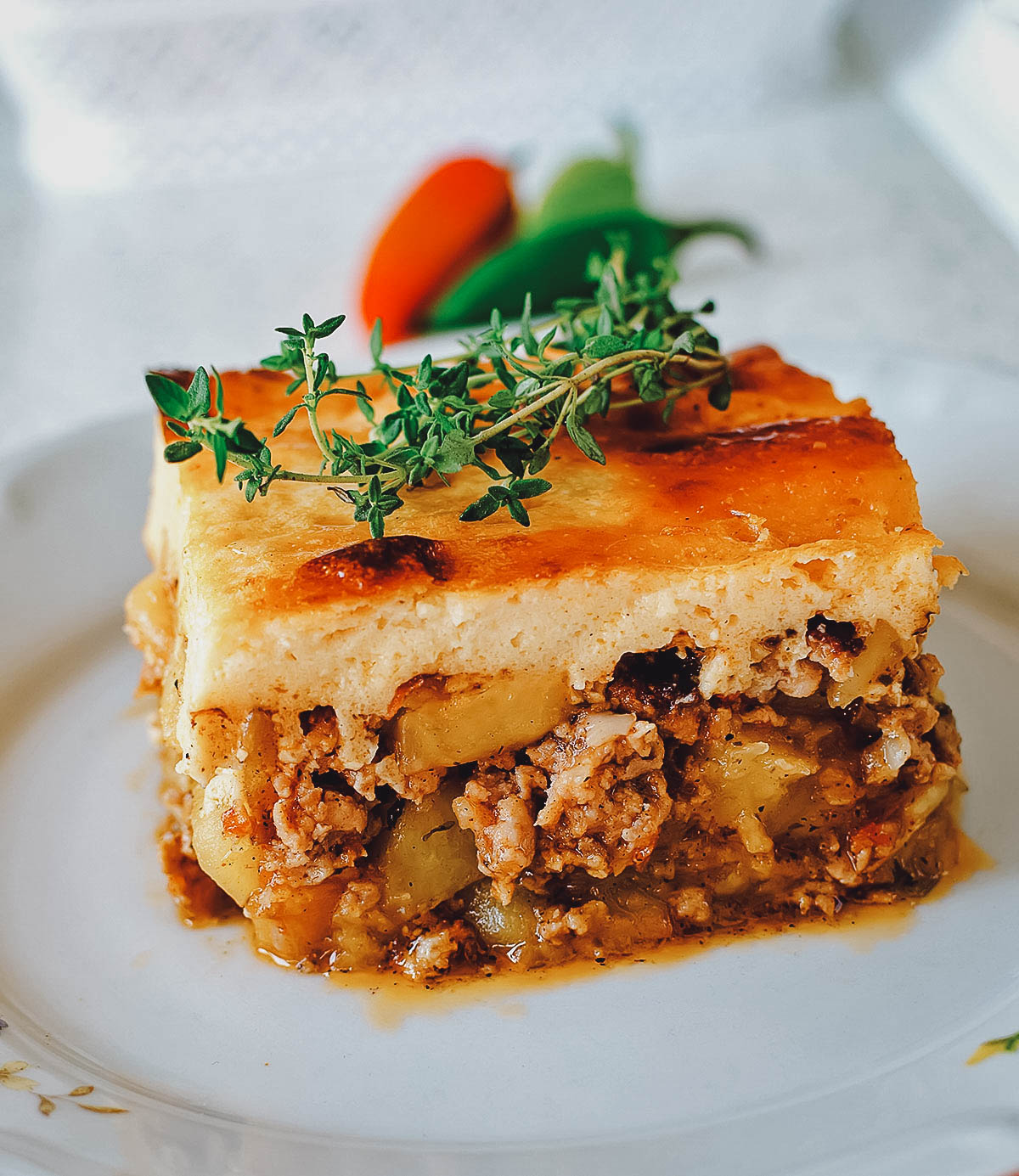 Bulgarian moussaka garnished with fresh herbs