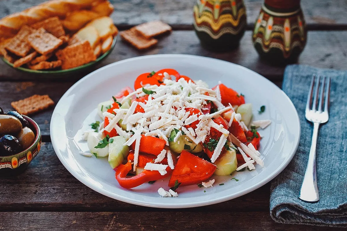 Bulgarian Food Shopska salad, a traditional salad made with fresh vegetables and Bulgarian cheese