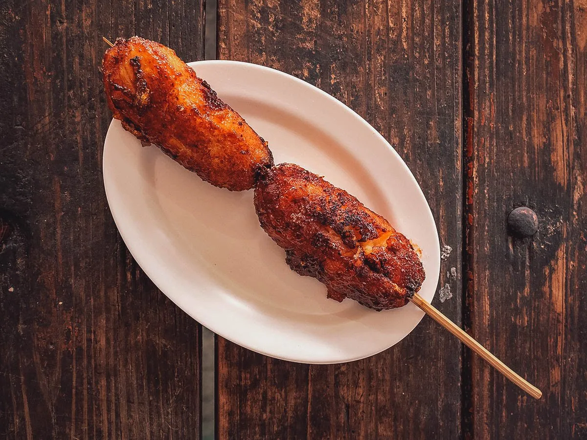 Filipino Desserts Stick of banana cue, deep-fried plantains coated in caramelized brown sugar