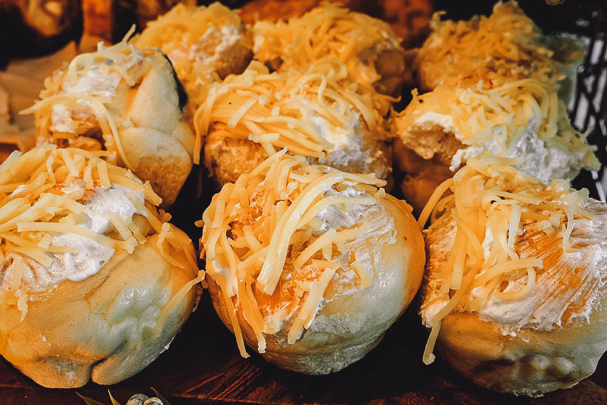 Ensaymada, Filipino brioche bread topped with buttercream and cheese