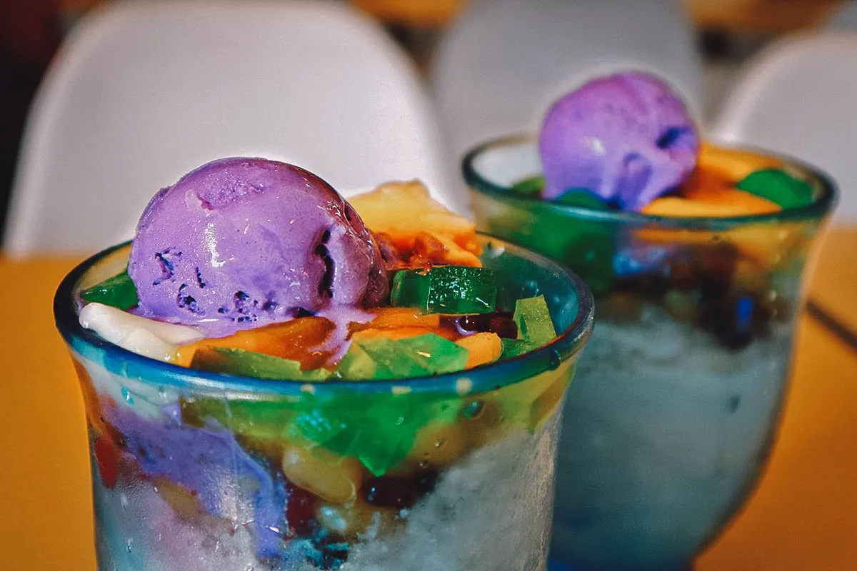 Filipino Desserts Glasses of halo-halo, a dessert made with shaved ice, sweetened condensed milk, leche flan, ube, etc