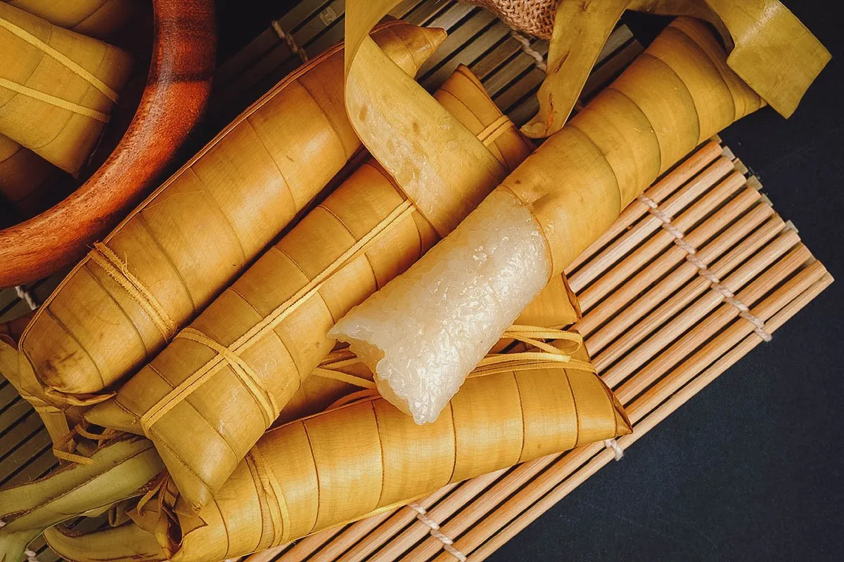 Filipino Desserts Several sticks of suman, a popular Filipino sticky rice dessert made with coconut milk