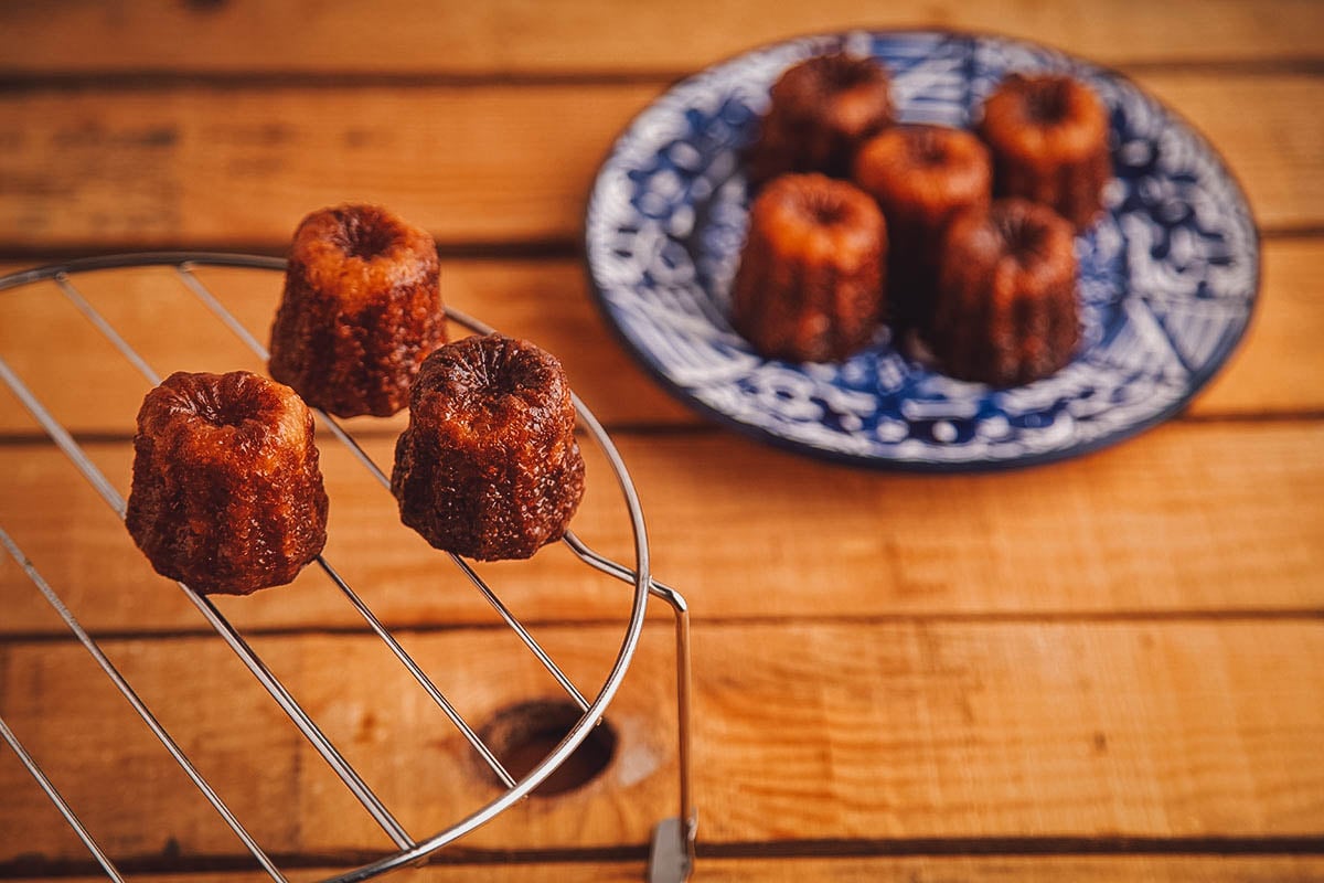 Canelé, a small French dessert with a custard-like interior and a burnt caramelized crust