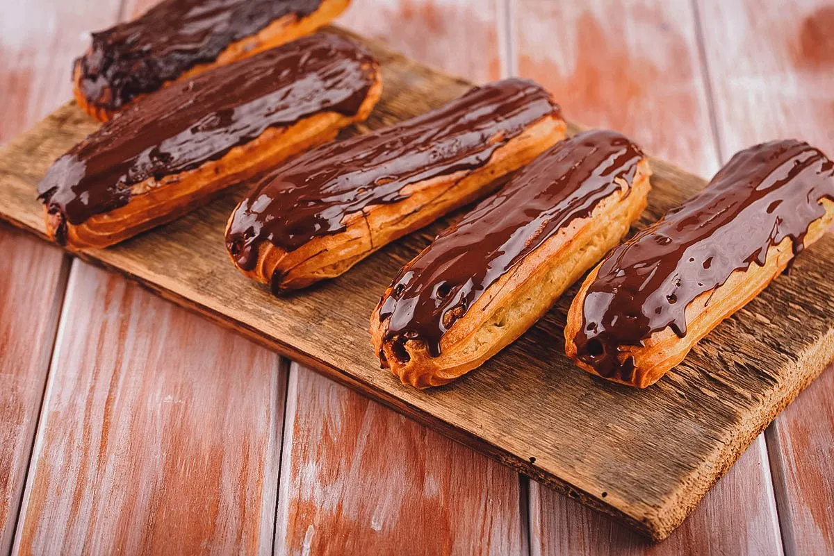 Éclair au chocolat filled with pastry cream and topped with chocolate ganache
