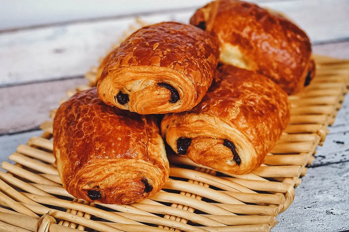 Pain au chocolat, a flaky pastry filled with dark chocolate or chocolate ganache