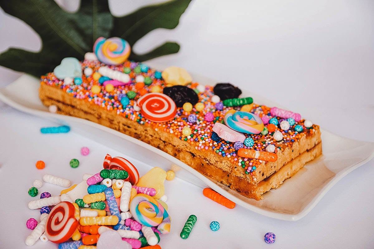 Turron de doña pepa, Peruvian dessert topped with colorful candies