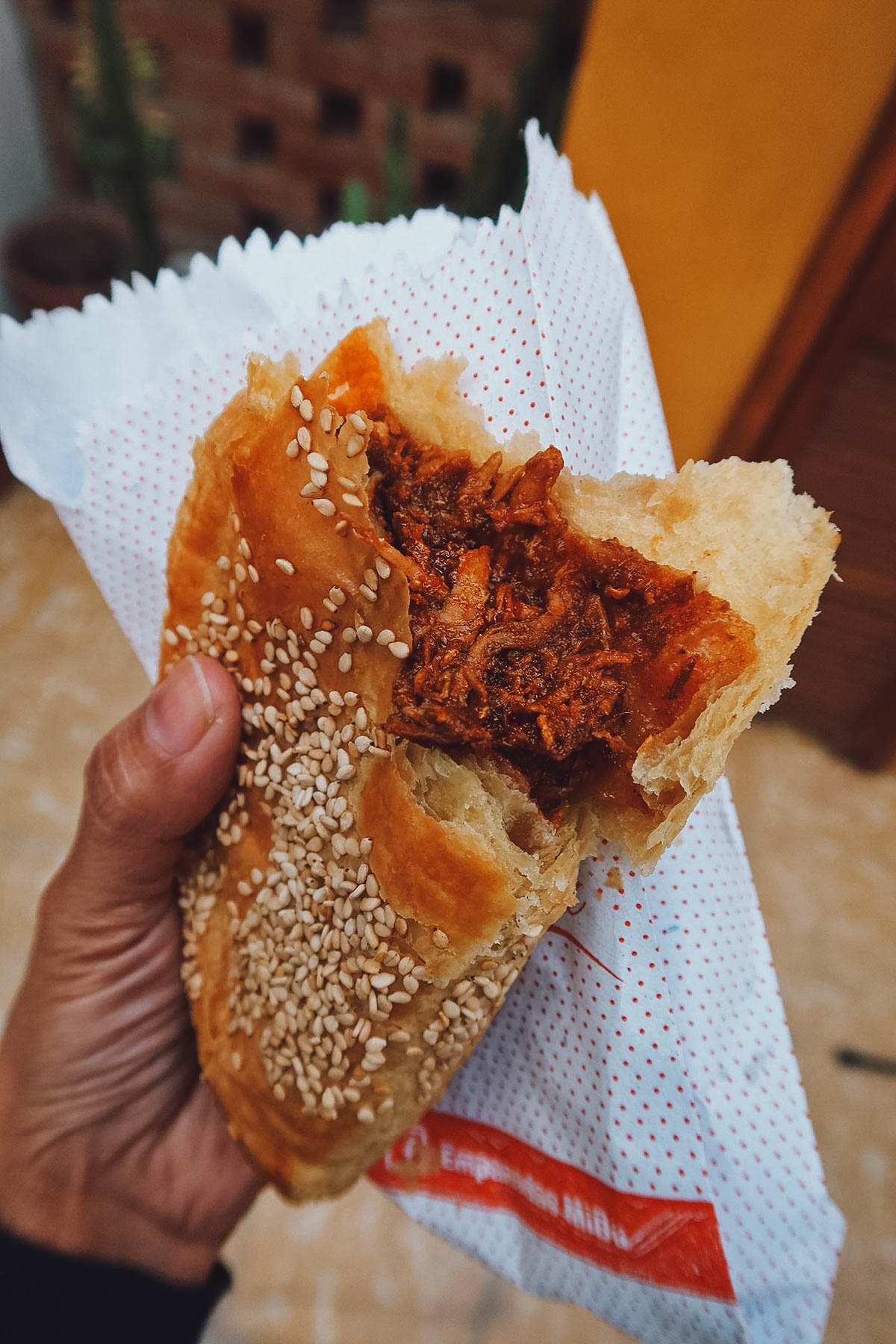 The filling of a mole rojo empanada