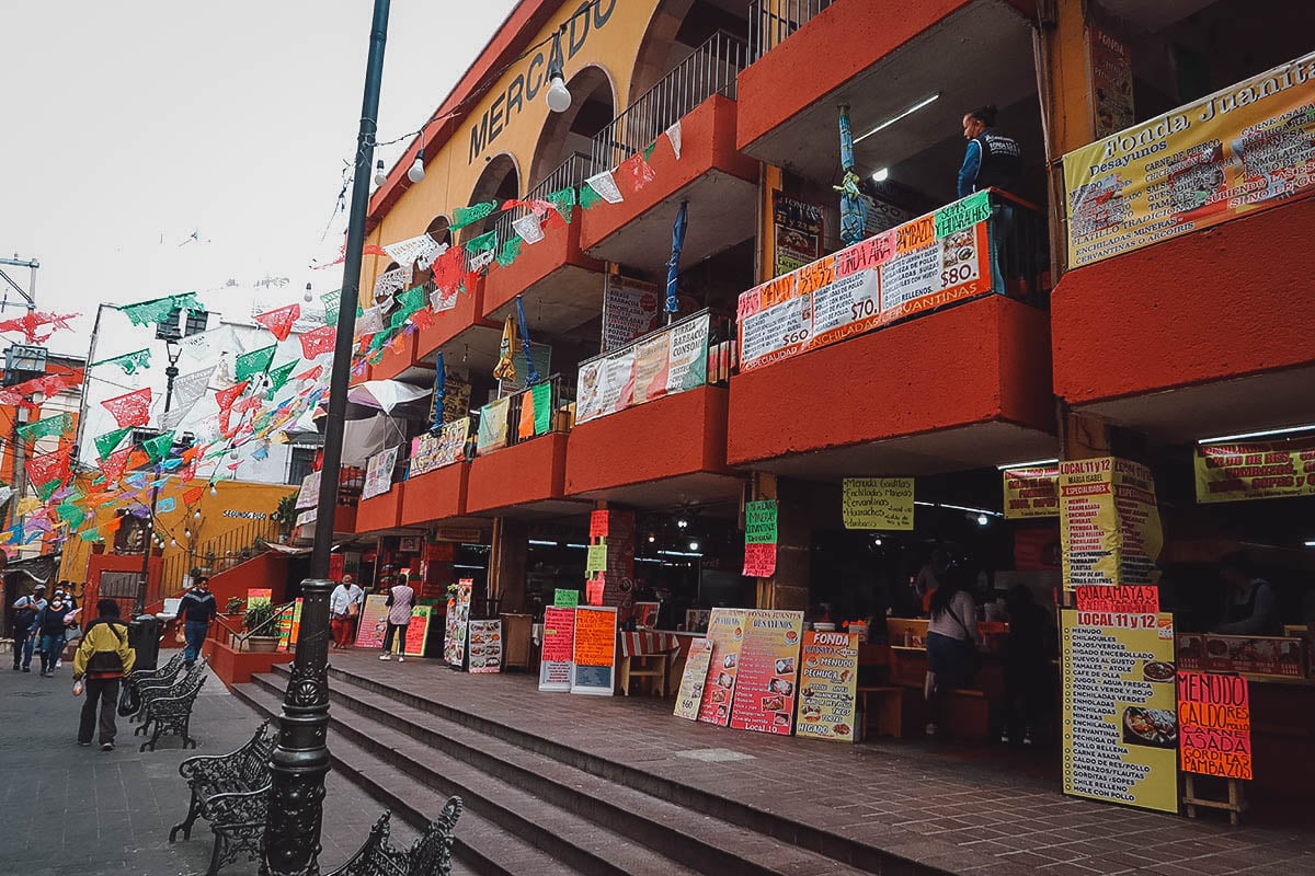 Building with local food stalls next to Mercado Hidalgo in Guanajuato