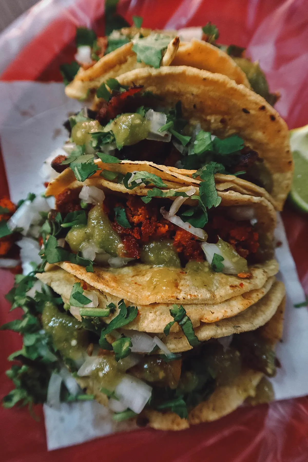 Set of 4 tacos with salsa verde at a restaurant in Guanajuato