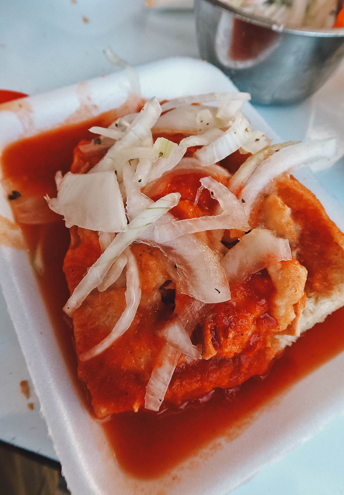Torta drowned in tomato and chili sauces at El Principe Heredero in Guadalajara