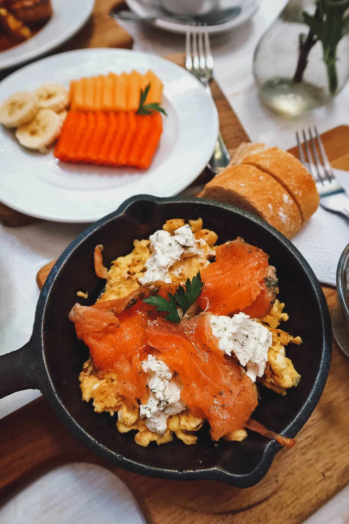 Smoked salmon with scrambled eggs, goat cheese, and onions