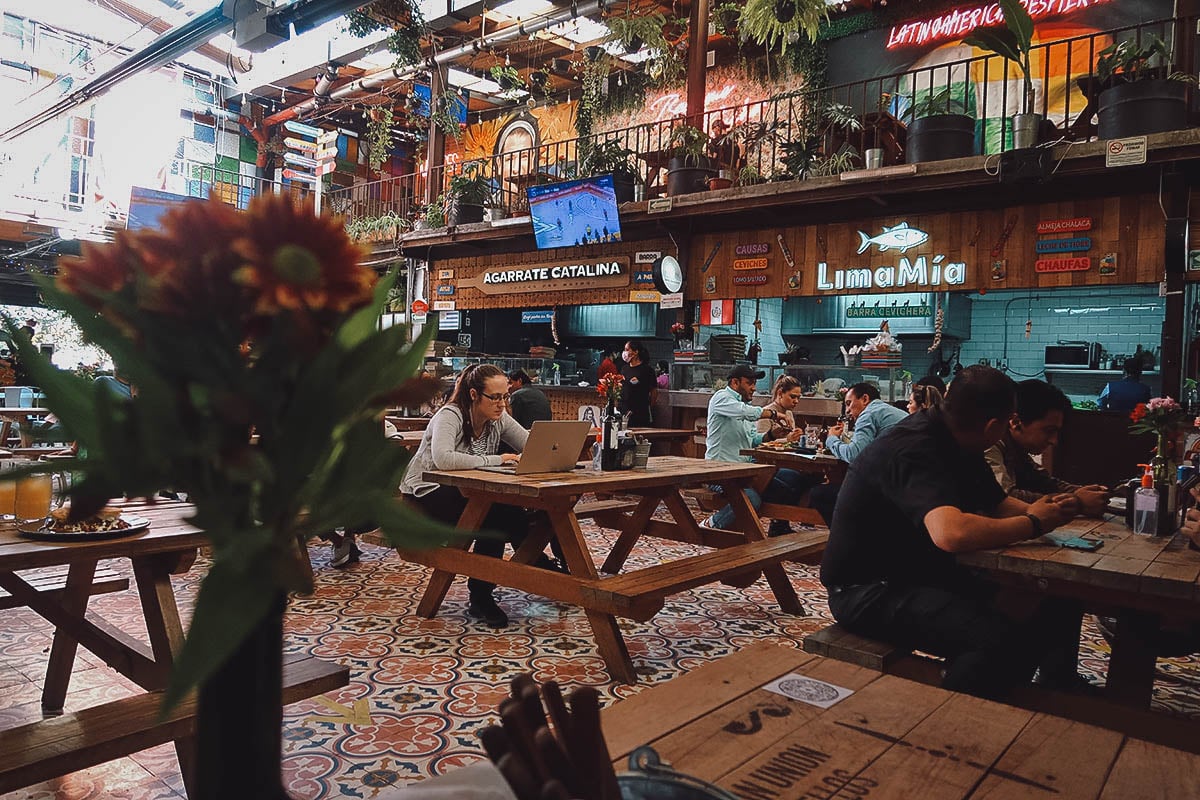 Dining area at Comedor de Los Milagros food hall in Mexico City