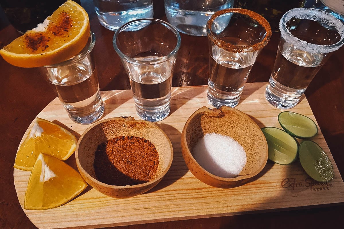 Tequila shots with salt, chili, and orange slices